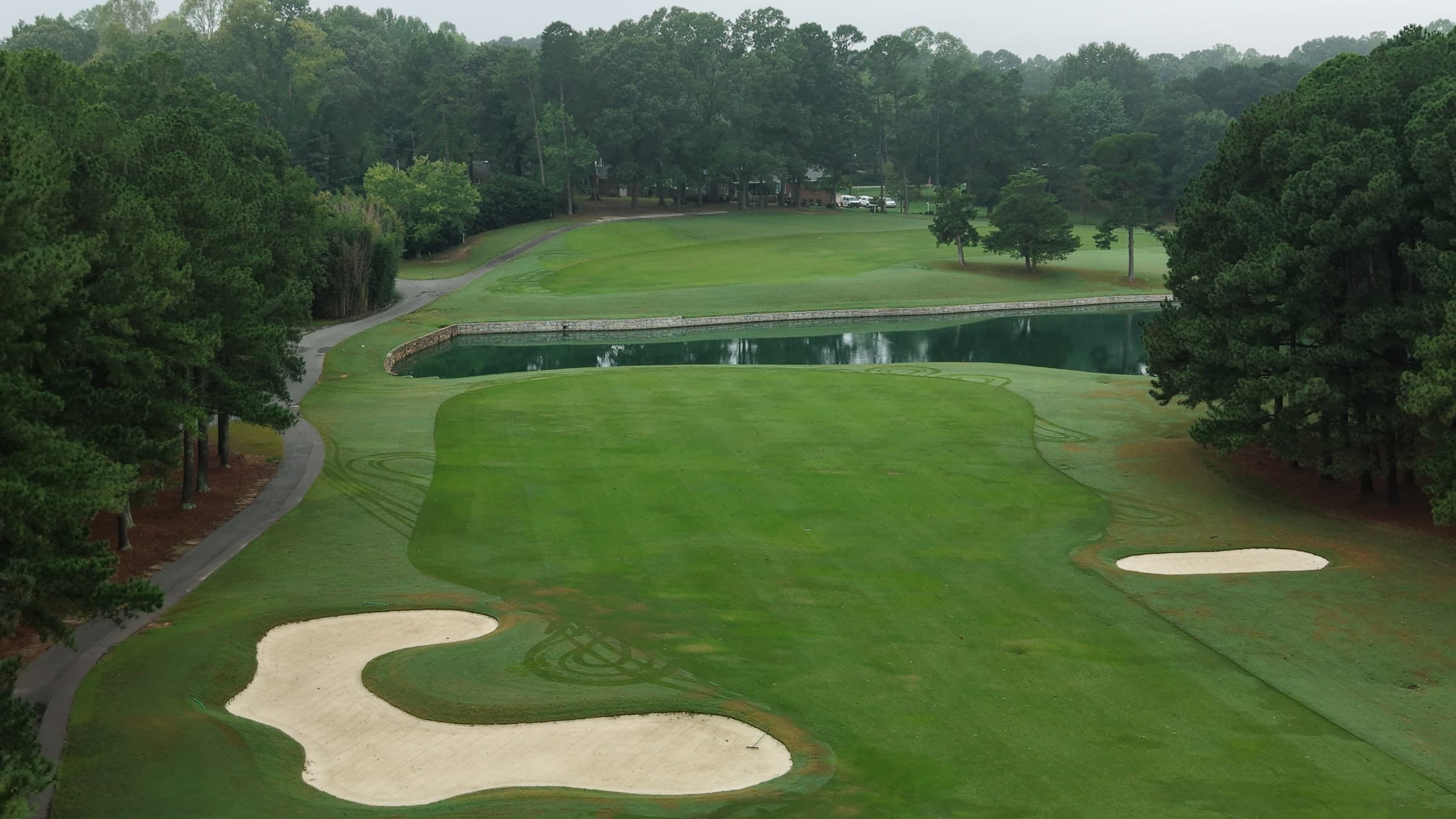 Aerial view of a golf hole at Forest Oaks Country Club
